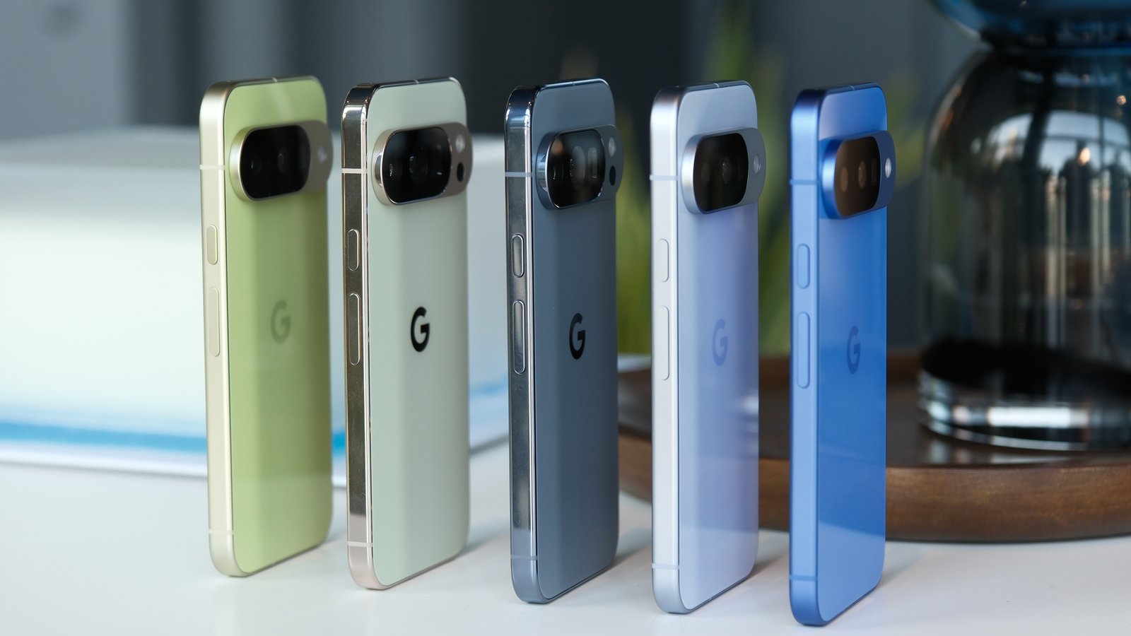 Multiple Pixel 10 and Pixel 10 Pro phones side by side from th eside showing color variations