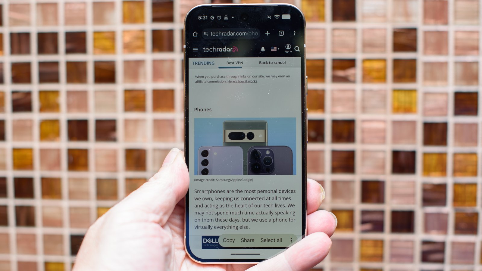 Google Pixel 10 Pro in Jade with checkered tile backsplash background